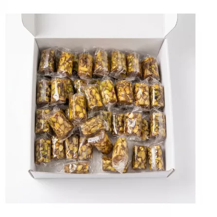 Individually wrapped Liban Vert Malban Araysseh Extra pistachio sweets in a box