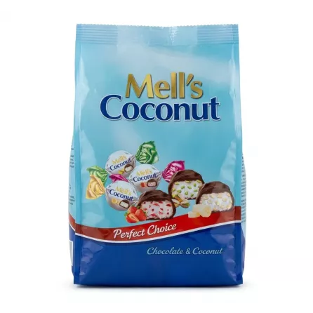 Mell's Coconut Sweets pack held in hand, shop display in background