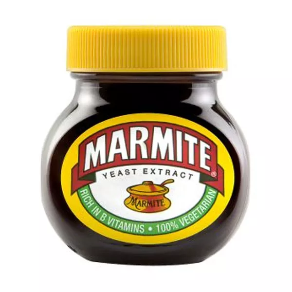 Marmite, the iconic British savory spread made with yeast extract. Spread it thin on toast for a delicious and nutritious breakfast rich in B vitamins. Explore its unique umami flavor.