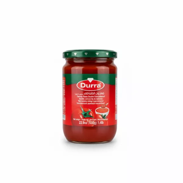 Jar of Durra Double Concentrated Tomato Paste held in hand