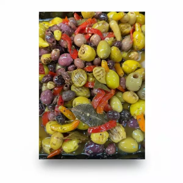 assorted marinated mixed olives with red and yellow peppers in marinade