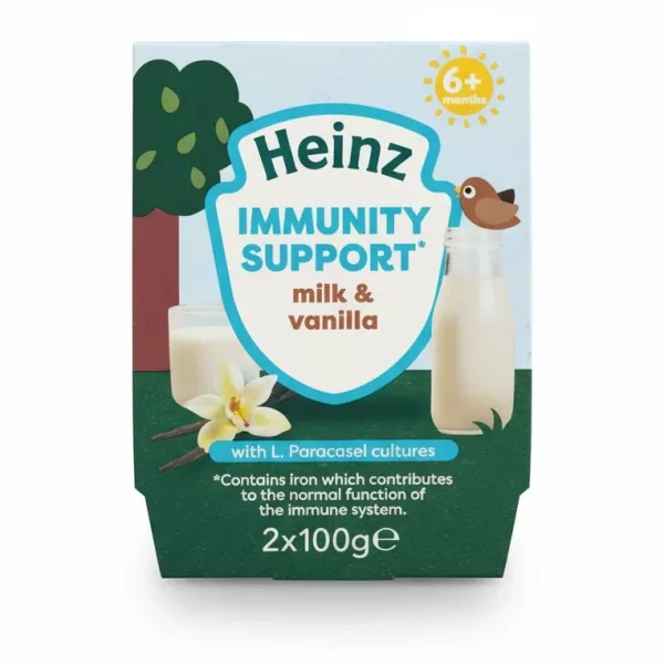 Heinz Immunity Support milk and vanilla 2 pack pots in hand showing front packaging