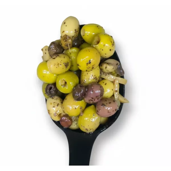 Mixed green olives marinated with herbs in oil with a black spoon
