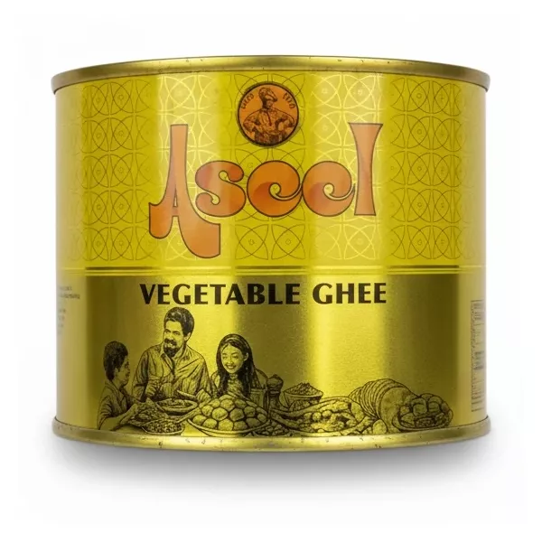 Ascol Vegetable Ghee 500ml golden tin held in hand