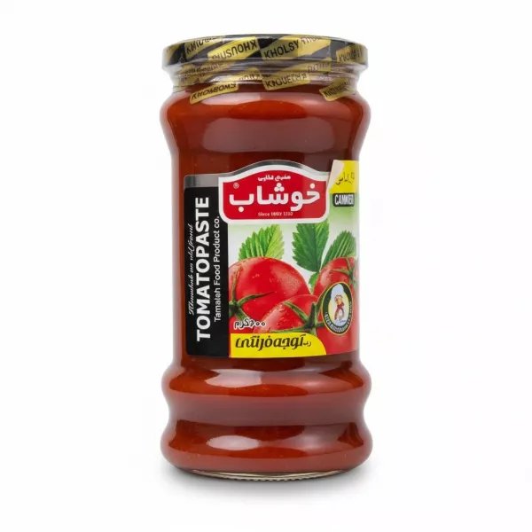 Glass jar of Khoushab tomato paste with label showing tomatoes and brand name