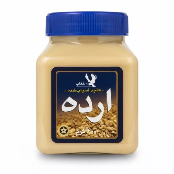Oghab brand tahini sesame paste container with blue lid and Arabic label