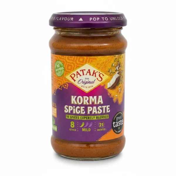 Glass jar of Patak's Korma Spice Paste with purple and orange label