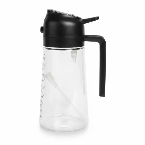 Transparent syrup dispenser bottle with black lid and handle
