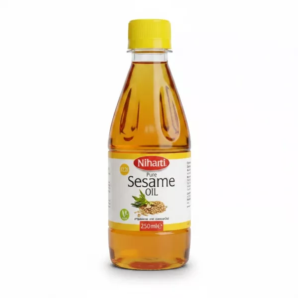 Bottle of Niharti Pure Sesame Oil with yellow cap and clear label