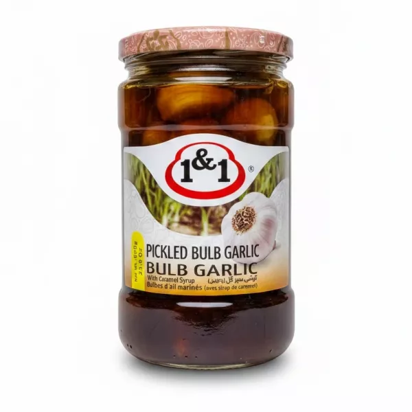 Jar of 1&1 Pickled Bulb Garlic with caramel syrup showing label