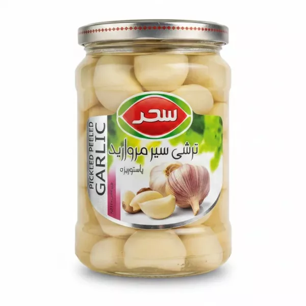 Jar of Sahar pickled peeled garlic cloves in brine