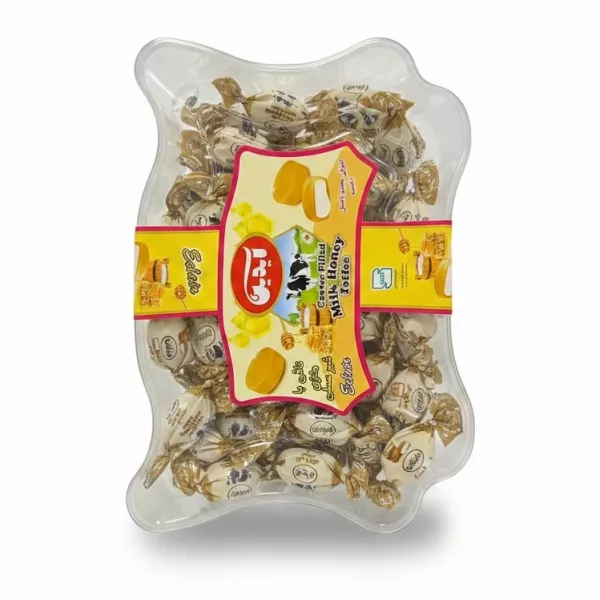 Clear plastic box containing individually wrapped milk honey toffee pieces