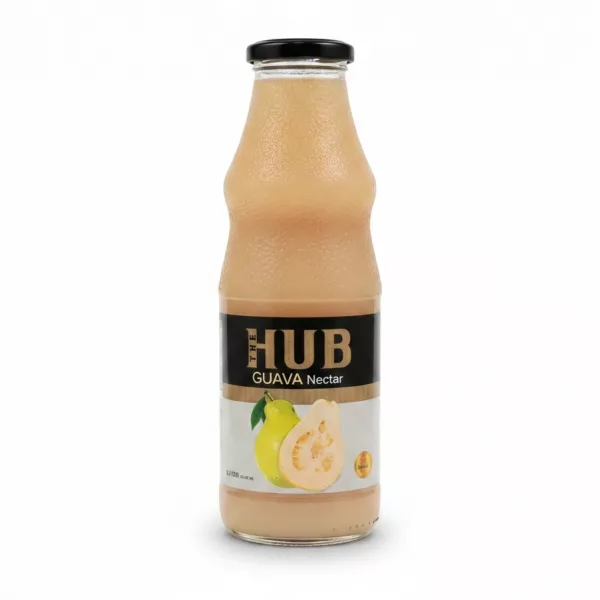 Glass bottle of The HUB Guava Nectar showing front label