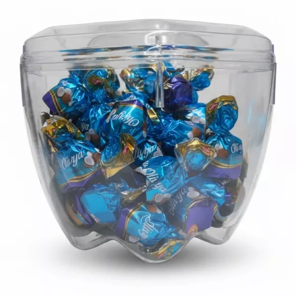 Transparent container full of individually wrapped assorted chocolates