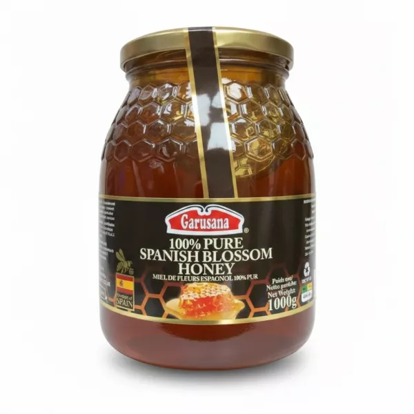 Garusana 100% pure Spanish blossom honey in a hexagonal patterned glass jar with gold lid