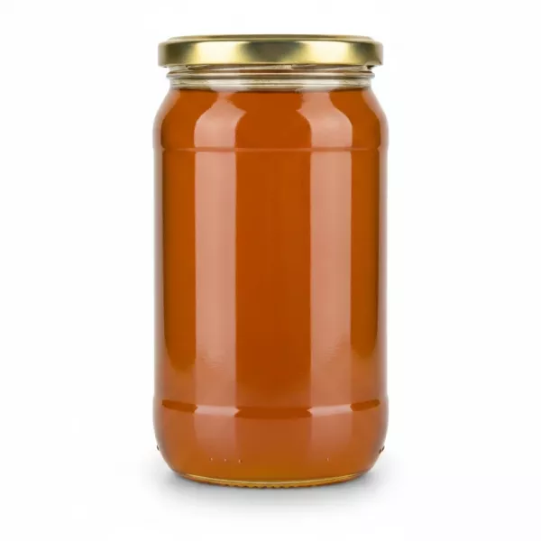 Clear golden multiflower honey in jar side view