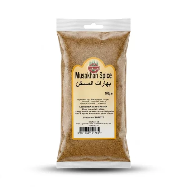 Enhanced Safa Musakhan Spice 100g packet held in hand in a grocery aisle