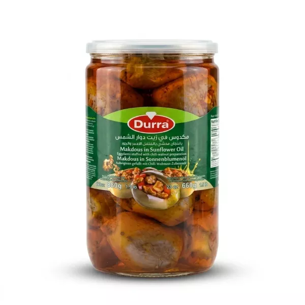 Enhanced Front view of Durra Makdous in Sunflower Oil 880g jar held in hand