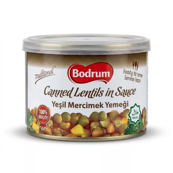 Enhanced Hand holding Bodrum Canned Lentils in Sauce 400g tin in a grocery store