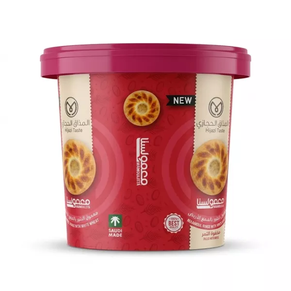 A professional e-commerce product photo of the Hijazi Taste Maamoulista Maamoul Rings white wheat tub, featuring a vivid red and pink label with illustrations of the traditional date-filled cookies, centered against a clean white background with soft, symmetrical shadows. PRODUCT TITLE: Hijazi Taste Maamoul Rings - Halal Dates Delight PRODUCT: Hijazi Taste Maamoulista Maamoul Rings with white wheat tub front view