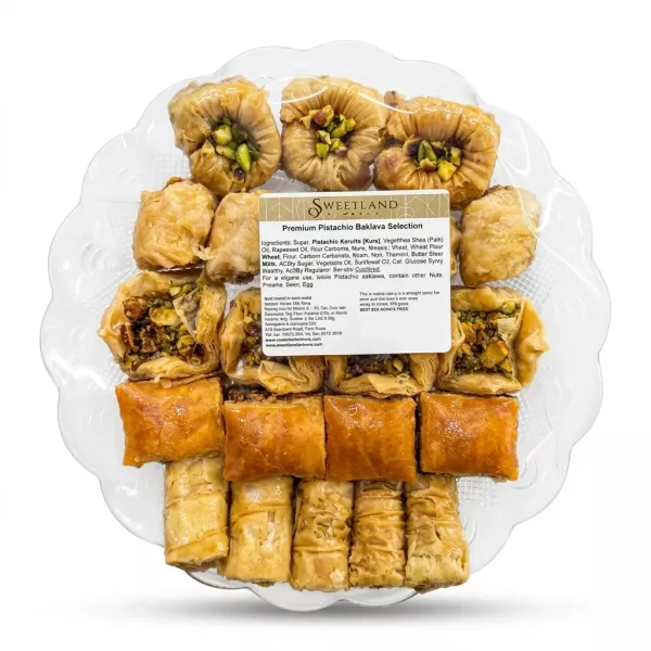 Enhanced Sweetland Premium Pistachio Baklava Selection in clear platter with assorted baklava shapes and ingredients label visible