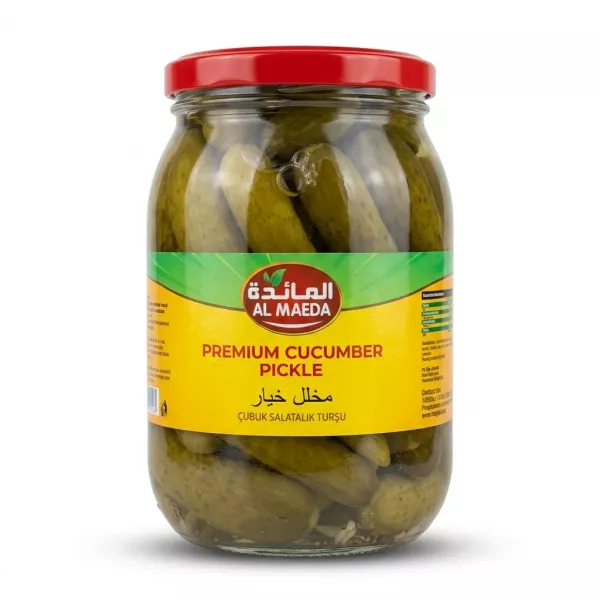 Al Maeda Premium Cucumber Pickle in a 1450g glass jar with a red lid. The jar is packed with whole pickled cucumbers and features a distinct yellow and green label with the brand logo in Arabic and English, centered against a clean white background.