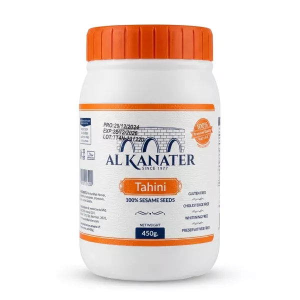 Enhanced Front of Al Kanater Tahini jar 450g in a person's hand