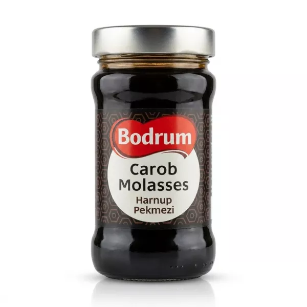Enhanced Front of Bodrum Carob Molasses jar held in hand