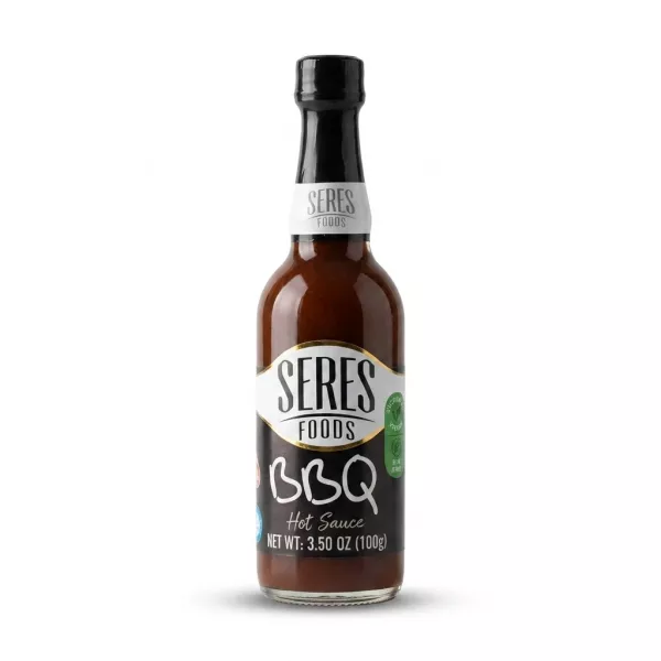 Enhanced Hand holding a bottle of Seres Foods BBQ Hot Sauce 100g