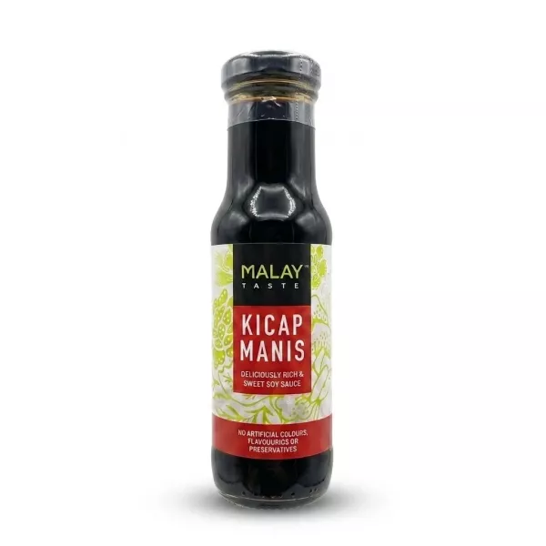 Enhanced A 150ml bottle of Malay Taste Kicap Manis Sweet Soy Sauce held by a hand. The glass bottle is filled with a dark sauce and has a black, white, and red label featuring green floral patterns and English text on a clean white background.