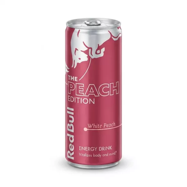 A 250ml can of Red Bull The Peach Edition White Peach energy drink, featuring its distinctive pink and silver design, is centered against a clean white background with a soft, even shadow.