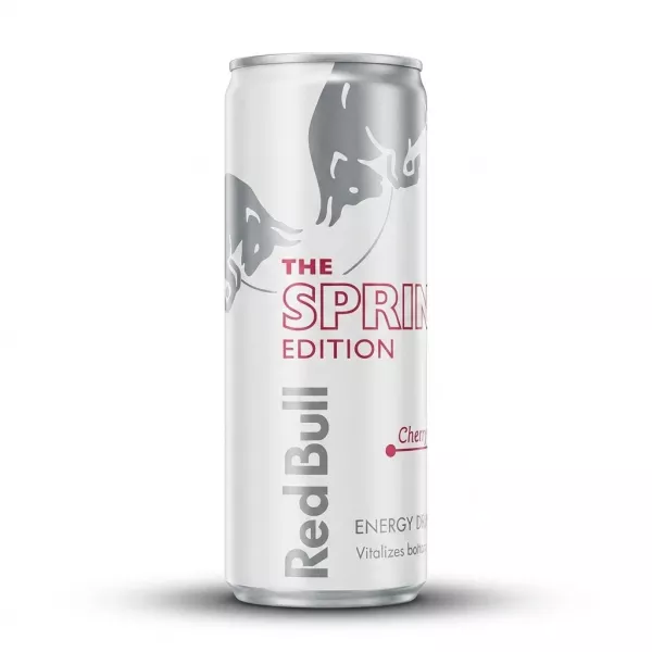 A professional studio photograph of a Red Bull Spring Edition Cherry Sakura energy drink can, featuring a white and silver design with a soft shadow on a white background.