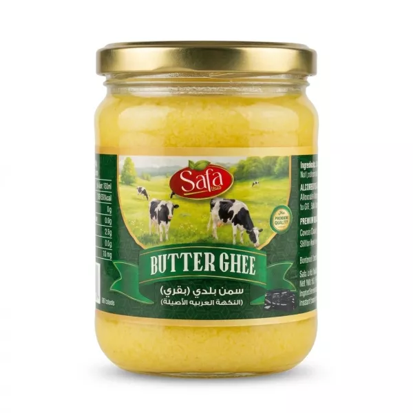 [Safa Butter Ghee - Halal Premium Quality Jar. A clear glass jar with a gold lid is filled with yellow ghee and features a green label with cows in a pasture. Text reads 'Safa BUTTER GHEE' and Arabic script for 'Premium Ghee'.]