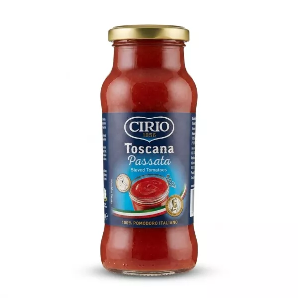 A 1:1 professional e-commerce product photograph of a centered glass jar of Cirio Toscana Passata Sieved Tomatoes against a clean, pure white background. The jar has a gold cap, and the blue label clearly displays the Cirio 1856 logo, 'Toscana Passata', 'Sieved Tomatoes', a bowl of sauce, and '100% POMODORO ITALIANO', with a soft, symmetrical shadow below.