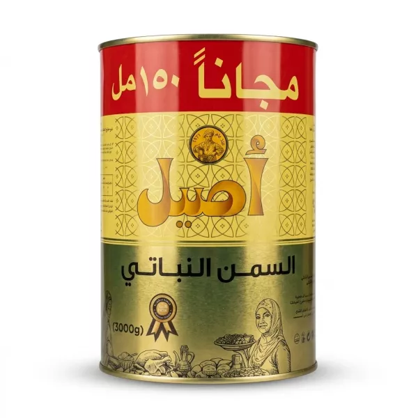 A professional studio photograph of an Aseel Vegetable Fat tin with Arabic branding in gold, red, and yellow, presented on a pure white background with a soft, even shadow. The tin is centrally positioned and fills the frame, showcasing the "Aseel" name and decorative packaging details in sharp focus.