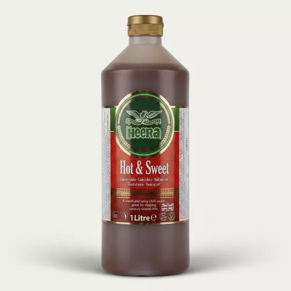 A 1-liter bottle of Heera Hot & Sweet Chilli Sauce is presented in a sharp, professional e-commerce product photo, centered with a clean background. The prominent front label details the product as Hot & Sweet Chilli Sauce in multiple languages and displays the Halal logo and Union Jack.