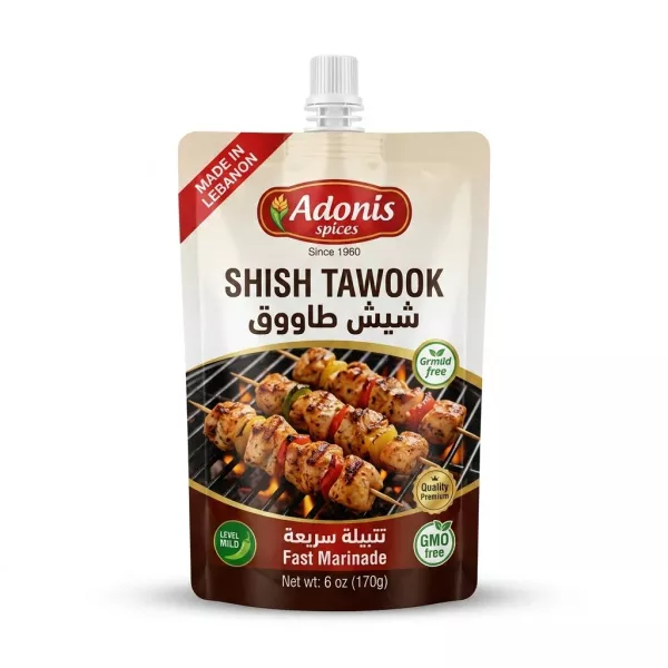 A 6 oz pouch of Adonis Spices Mild Shish Tawook Fast Marinade, showing the product label with grilled chicken skewers.