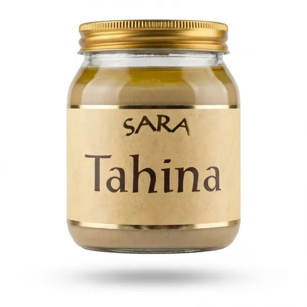 A 340g glass jar of SARA Tahina sesame paste with a golden lid and parchment label, presented in a centered e-commerce shot with a soft shadow.