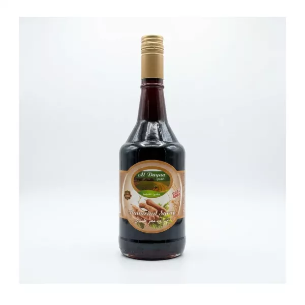 Enhanced Front view of Al Dayaa Tamarind Syrup 600ml bottle held in hand