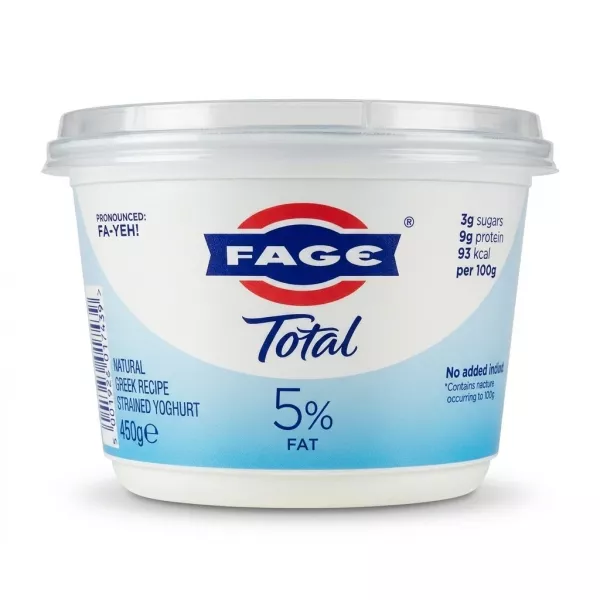 Enhanced FAGE Total 5% Greek yoghurt 450g tub held in hand above store shelf