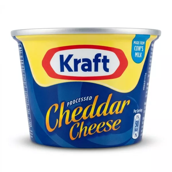 A 190g tub of Kraft Processed Cheddar Cheese is centrally positioned on a clean white background. It features the classic red and white Kraft logo above the product name in blue and gold lettering, under professional studio lighting.