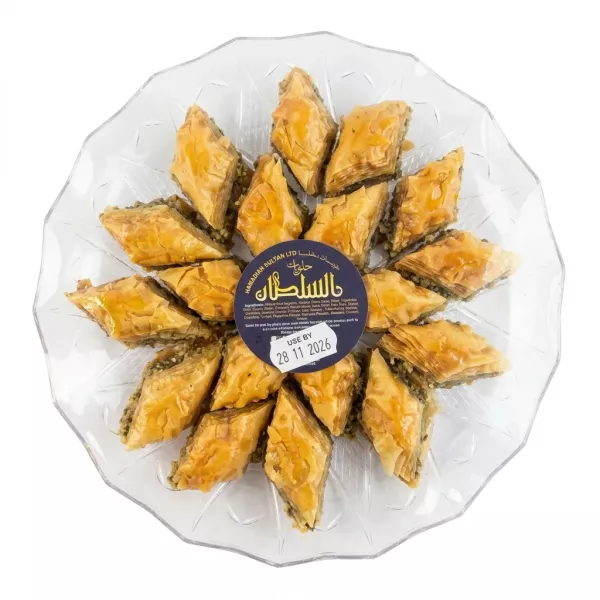 Tray of Sultan baklava with individually cut golden pastries wrapped in clear packaging