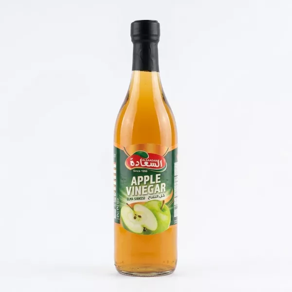 Front view of Alsaadah Apple Vinegar 500ml glass bottle on a store shelf
