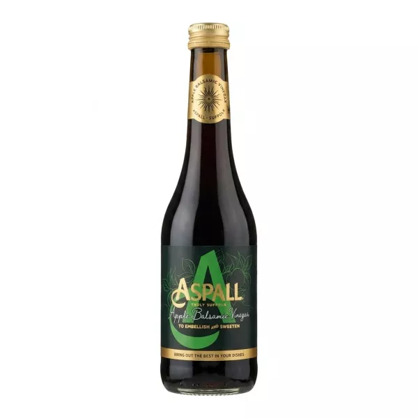 Hand holding a bottle of Aspall Apple Balsamic Vinegar in a shop aisle