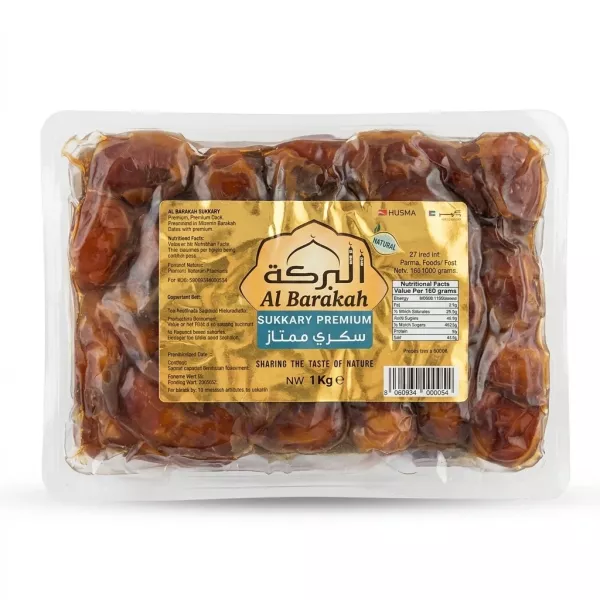 Front view of Al Barakah Sukkary Premium Dates 1kg pack held in hand showing the gold packaging and price label