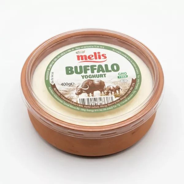 Hand holding Melis Buffalo Yoghurt 400g container in a shop aisle