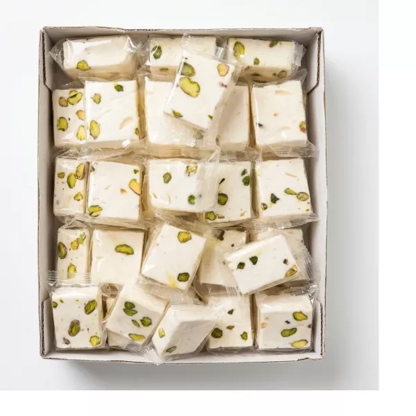 Individually wrapped pieces of Liban Vert Nougat Extra with pistachios in a box