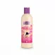 Aussie Bouncy Curls Shampoo bottle with purple cap and pink label held in hand
