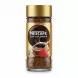 Side view of glass jar with coffee granules and product label of Nescafe Cap Colombia