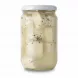 Close-up of white cheese cubes with black seeds submerged in brine in a glass jar